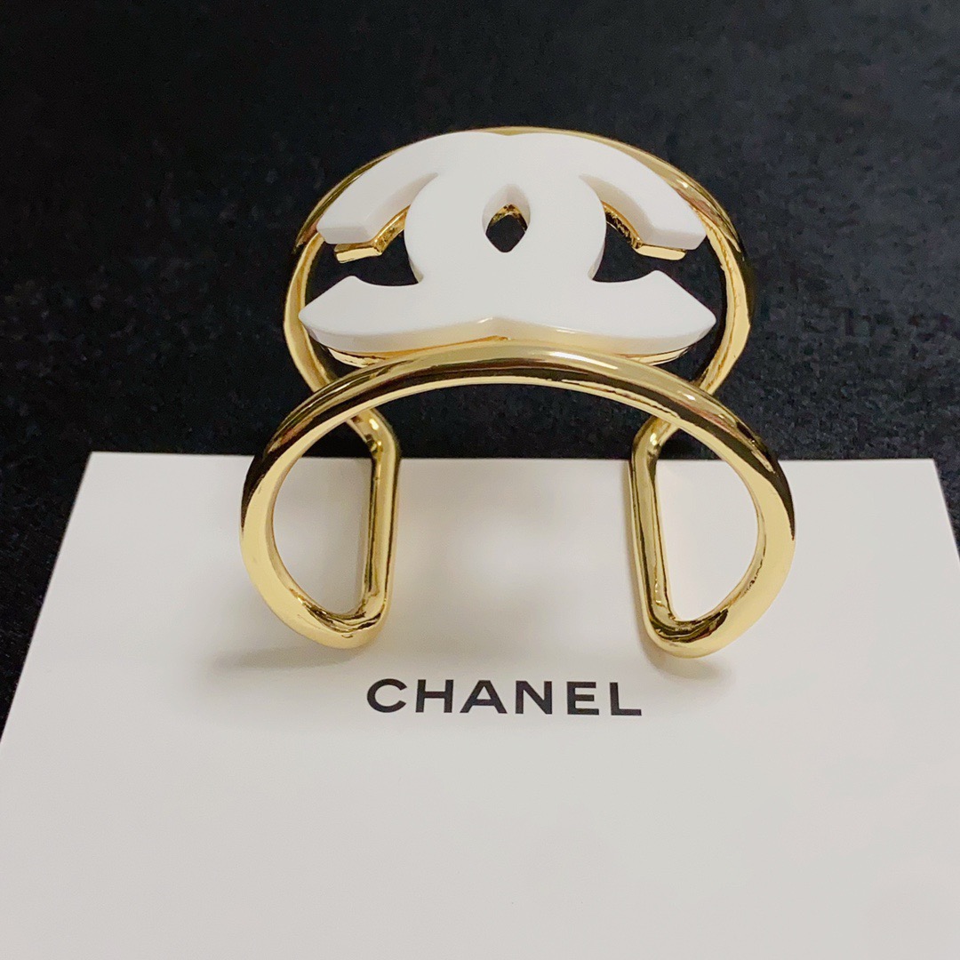 Chanel CC Logo Cuff bracelet Gold-tone metal with white resin CC logo One Size fits 16-18cm wrist