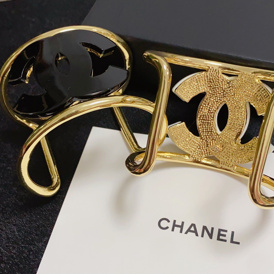 Chanel CC Logo Cuff bracelet Gold-tone metal with white resin CC logo One Size fits 16-18cm wrist