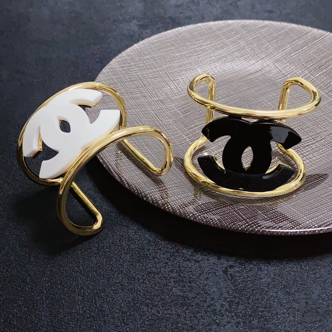 Chanel CC Logo Cuff bracelet Gold-tone metal with white resin CC logo One Size fits 16-18cm wrist