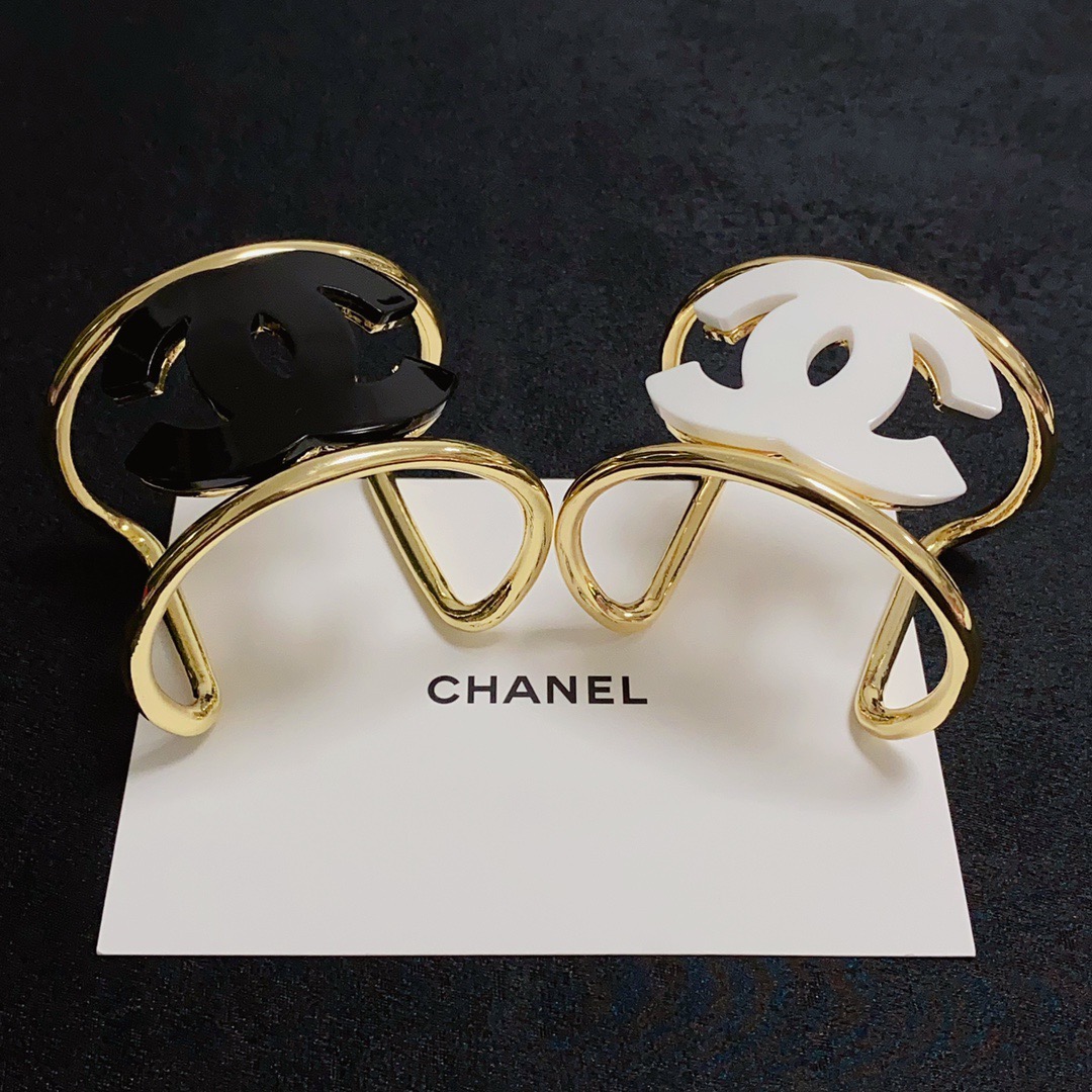 Chanel CC Logo Cuff bracelet Gold-tone metal with white resin CC logo One Size fits 16-18cm wrist