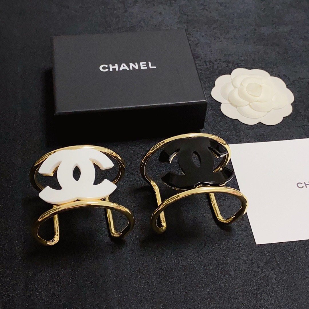 Chanel CC Logo Cuff bracelet Gold-tone metal with white resin CC logo One Size fits 16-18cm wrist