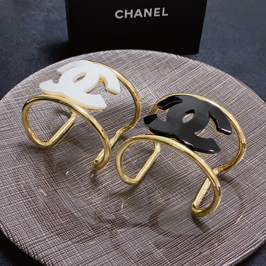 Chanel CC Logo Cuff bracelet Gold-tone metal with white resin CC logo One Size fits 16-18cm wrist