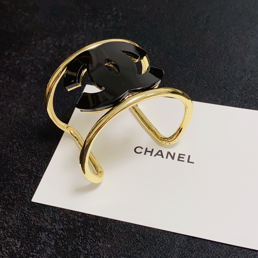 Chanel CC Logo Cuff bracelet Gold-tone metal with white resin CC logo One Size fits 16-18cm wrist