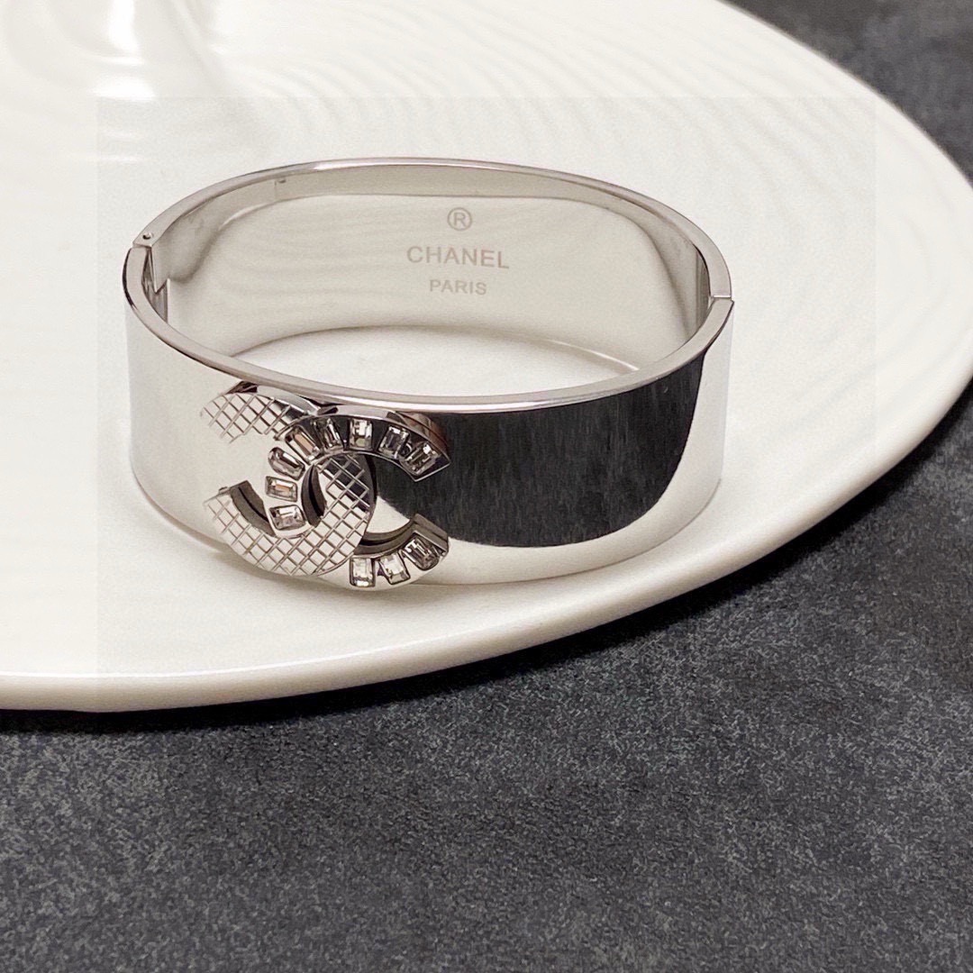 Chanel CC Logo Quilted Crystal Wide Cuff bracelet Silver-tone metal with clear baguette-cut crystals One Size standard wide cuff inner circumference 17cm
