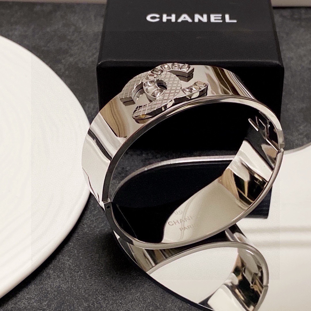 Chanel CC Logo Quilted Crystal Wide Cuff bracelet Silver-tone metal with clear baguette-cut crystals One Size standard wide cuff inner circumference 17cm