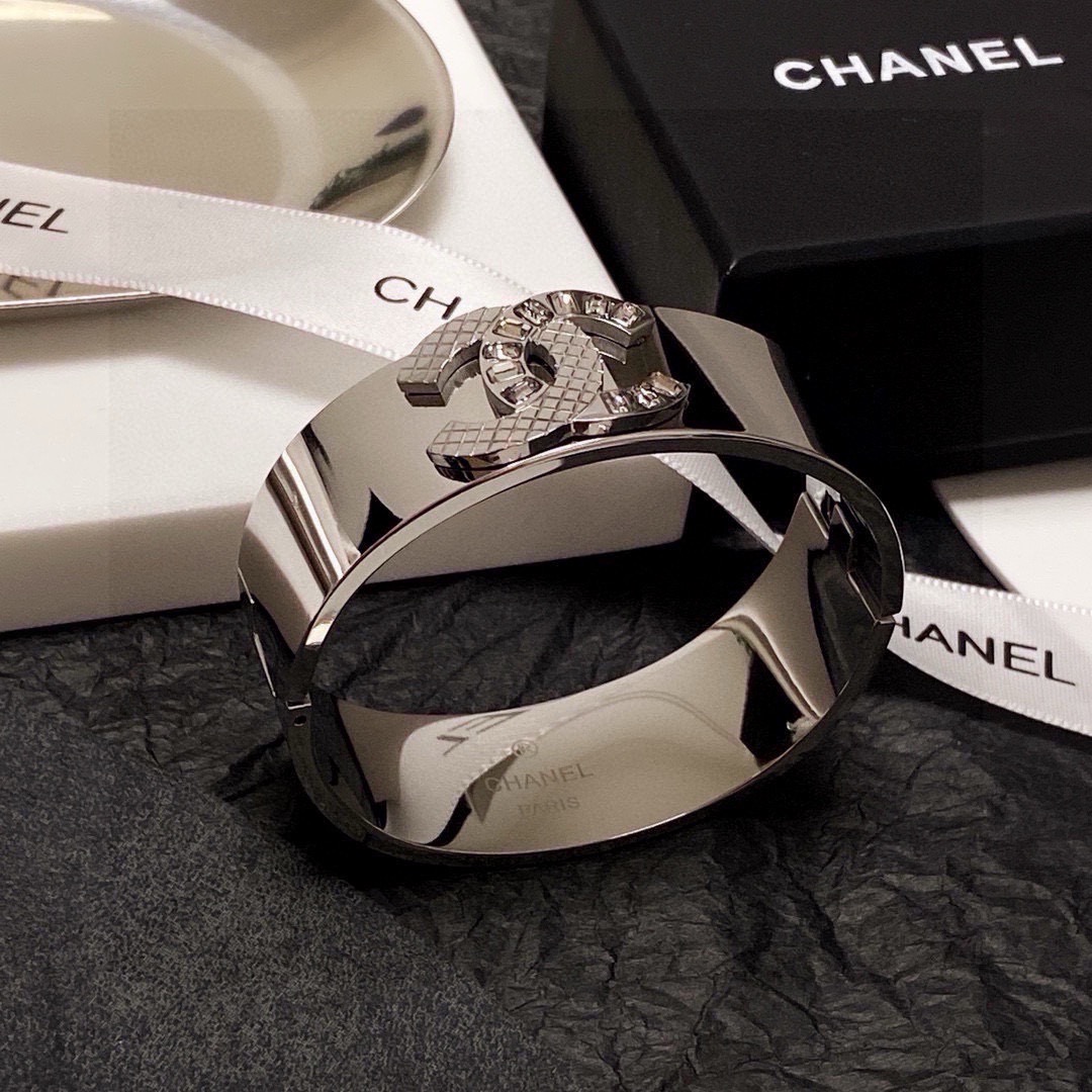 Chanel CC Logo Quilted Crystal Wide Cuff bracelet Silver-tone metal with clear baguette-cut crystals One Size standard wide cuff inner circumference 17cm