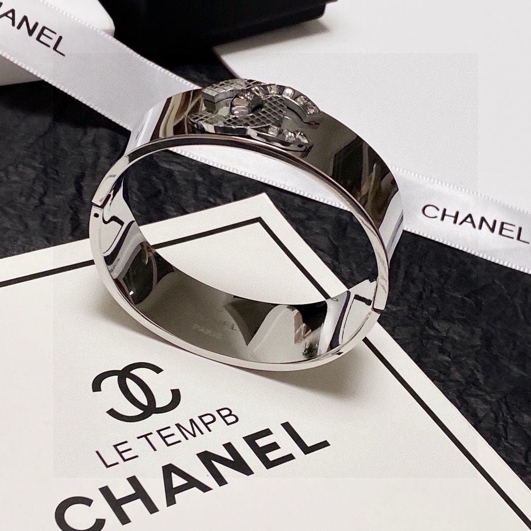 Chanel CC Logo Quilted Crystal Wide Cuff bracelet Silver-tone metal with clear baguette-cut crystals One Size standard wide cuff inner circumference 17cm