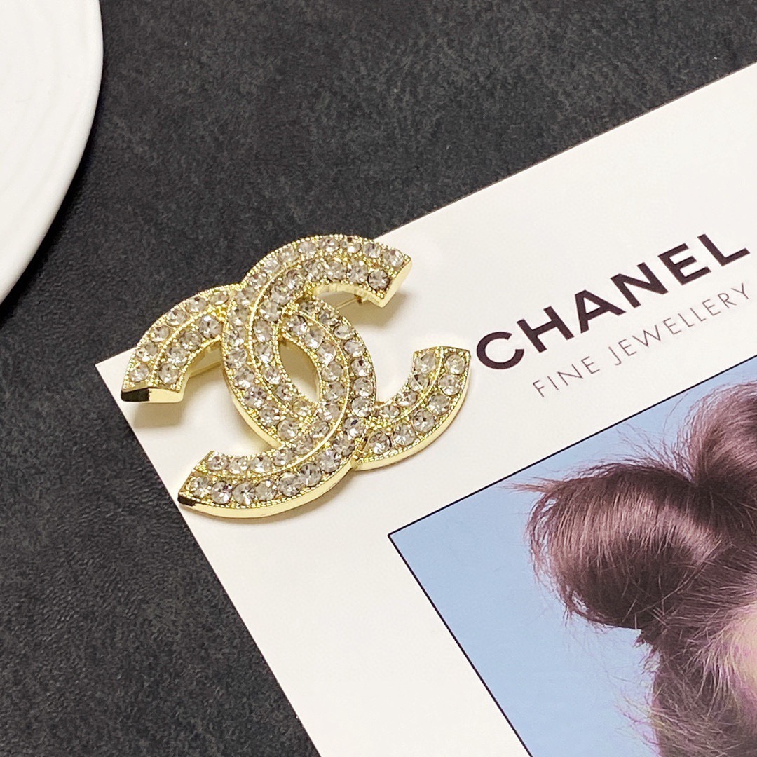Chanel CC Logo Crystal Brooch brooch silver-tone metal with clear crystal pave gold-tone metal with clear crystal pave 3cm width