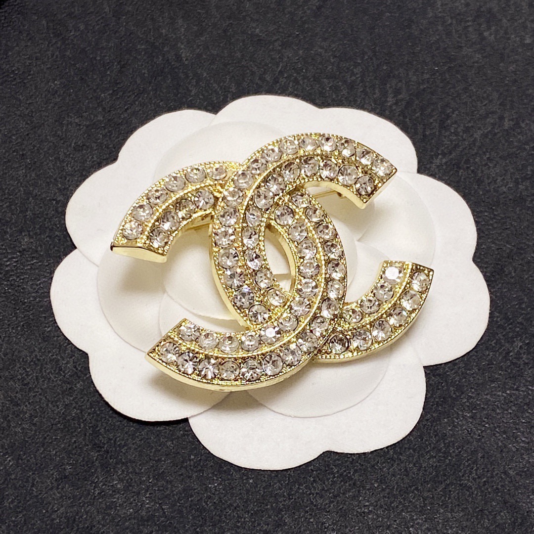 Chanel CC Logo Crystal Brooch brooch silver-tone metal with clear crystal pave gold-tone metal with clear crystal pave 3cm width