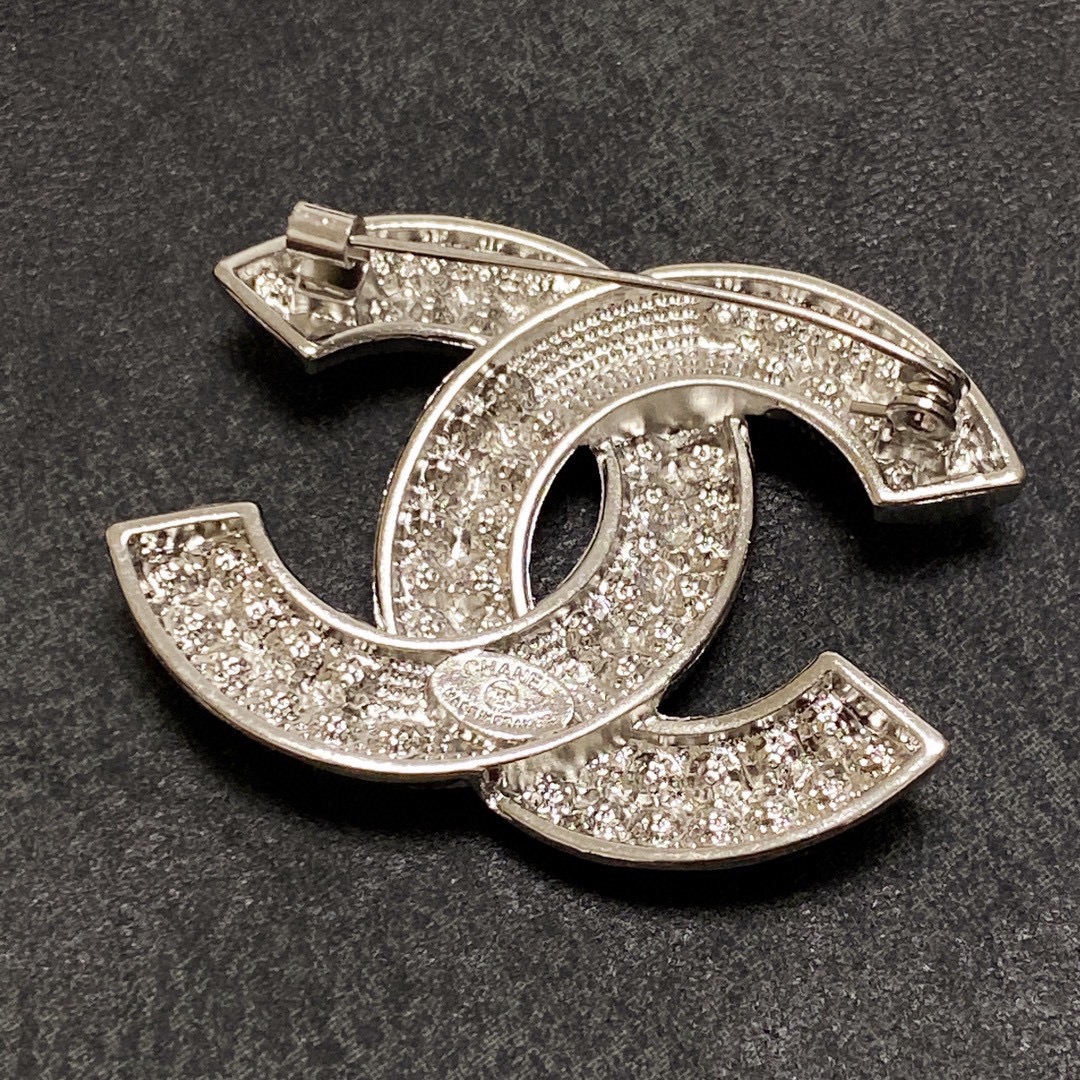 Chanel CC Logo Crystal Brooch brooch silver-tone metal with clear crystal pave gold-tone metal with clear crystal pave 3cm width