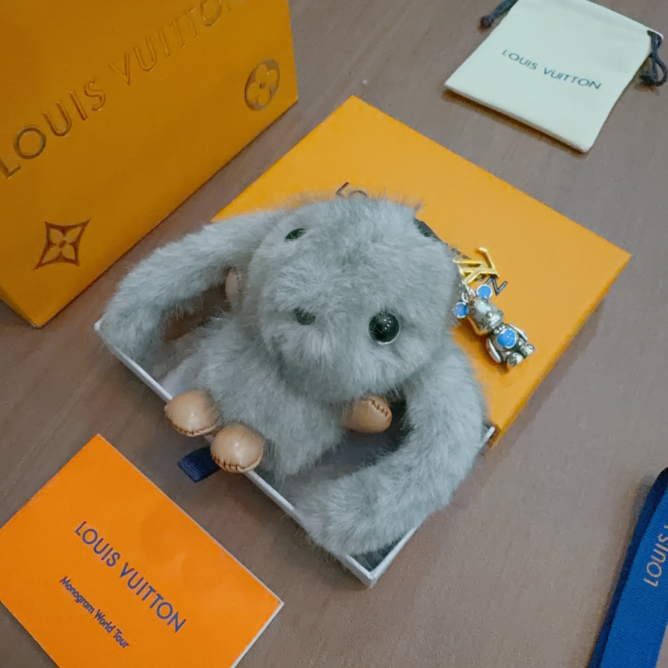 Louis Vuitton Anger Forest Bunny Keychain pendant gray mink fur tan leather silver-tone metal blue enamel gold-tone LV logo 12cm total length
