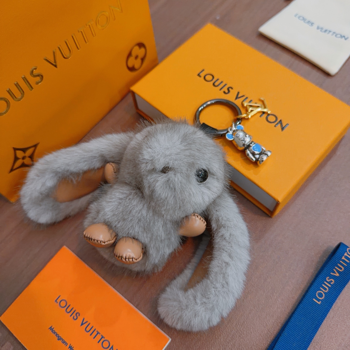 Louis Vuitton Anger Forest Bunny Keychain pendant gray mink fur tan leather silver-tone metal blue enamel gold-tone LV logo 12cm total length