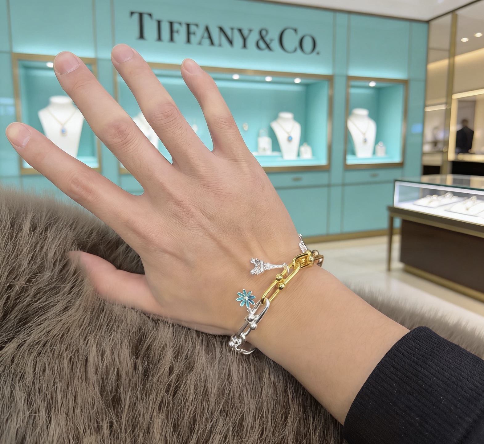 Tiffany Co HardWear Charm Bracelet bracelet Tri-tone sterling silver 18k yellow gold 18k rose gold metal with blue enamel daisy silver key charm silver Eiffel Tower charm 7 inches