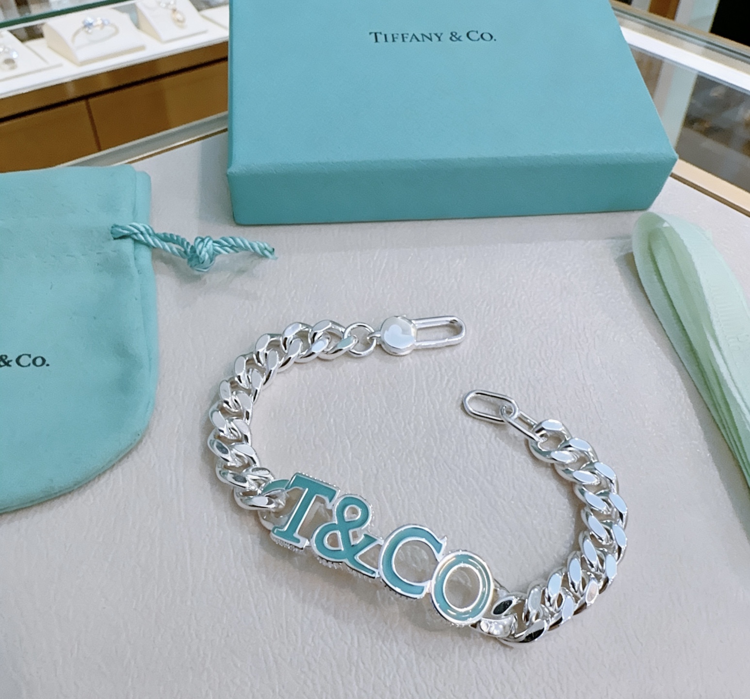 Tiffany Co T CO Logo Curb Chain bracelet Sterling silver with Tiffany Blue enamel 7 inches