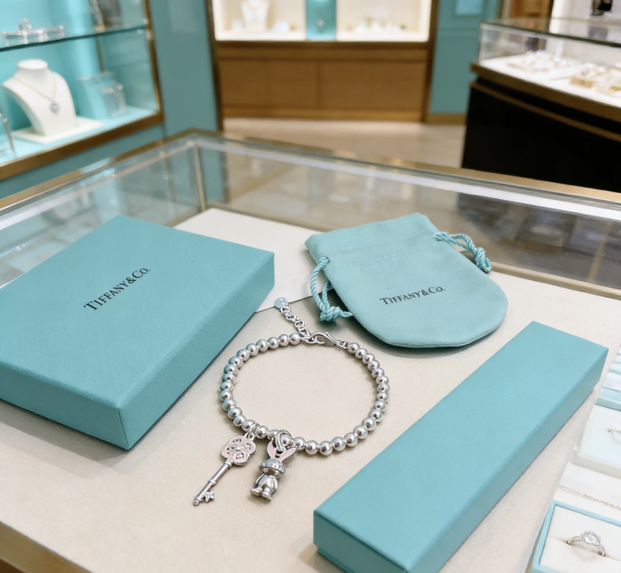 Tiffany Co Return to Tiffany Bead Charm Bracelet bracelet Silver metal with pink enamel and clear stone accents 17cm