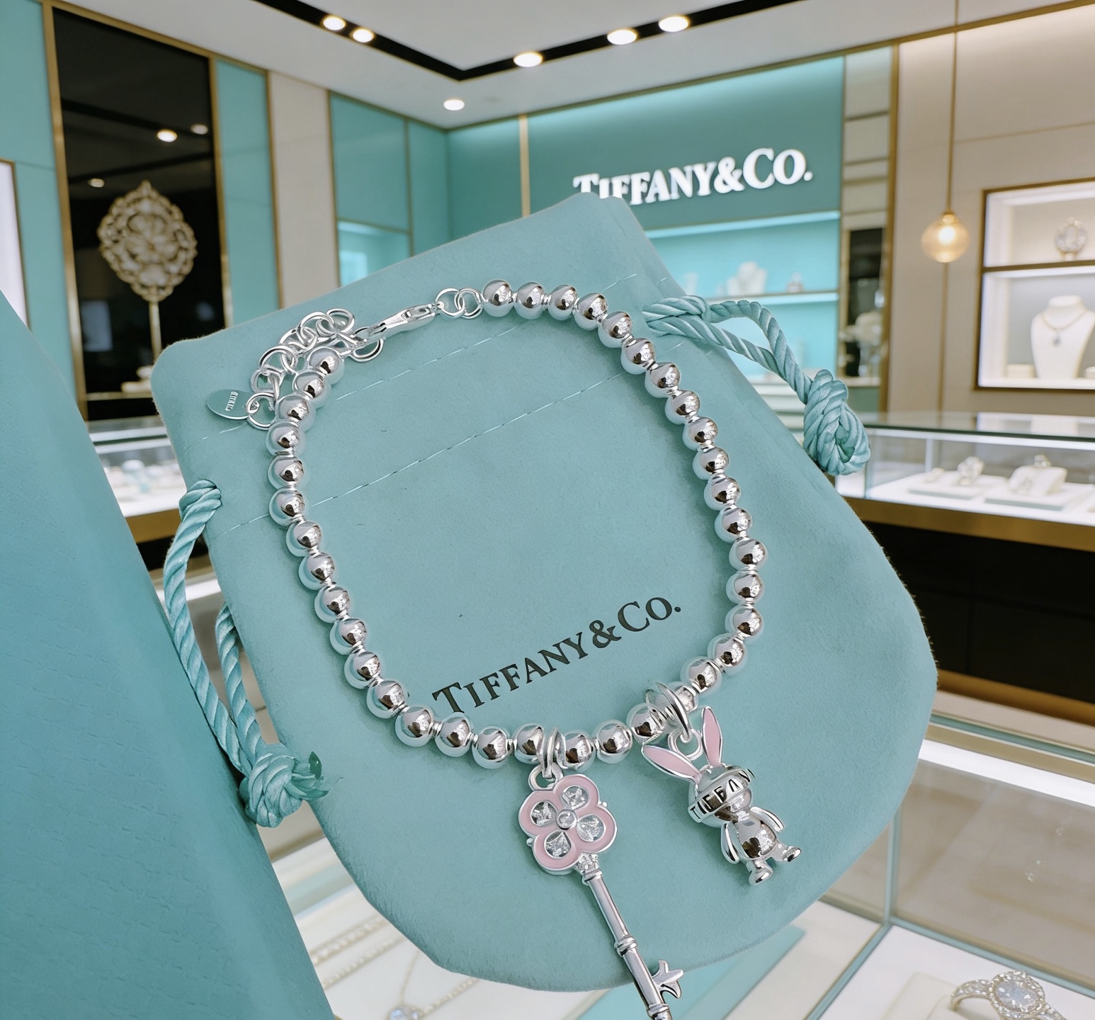 Tiffany Co Return to Tiffany Bead Charm Bracelet bracelet Silver metal with pink enamel and clear stone accents 17cm