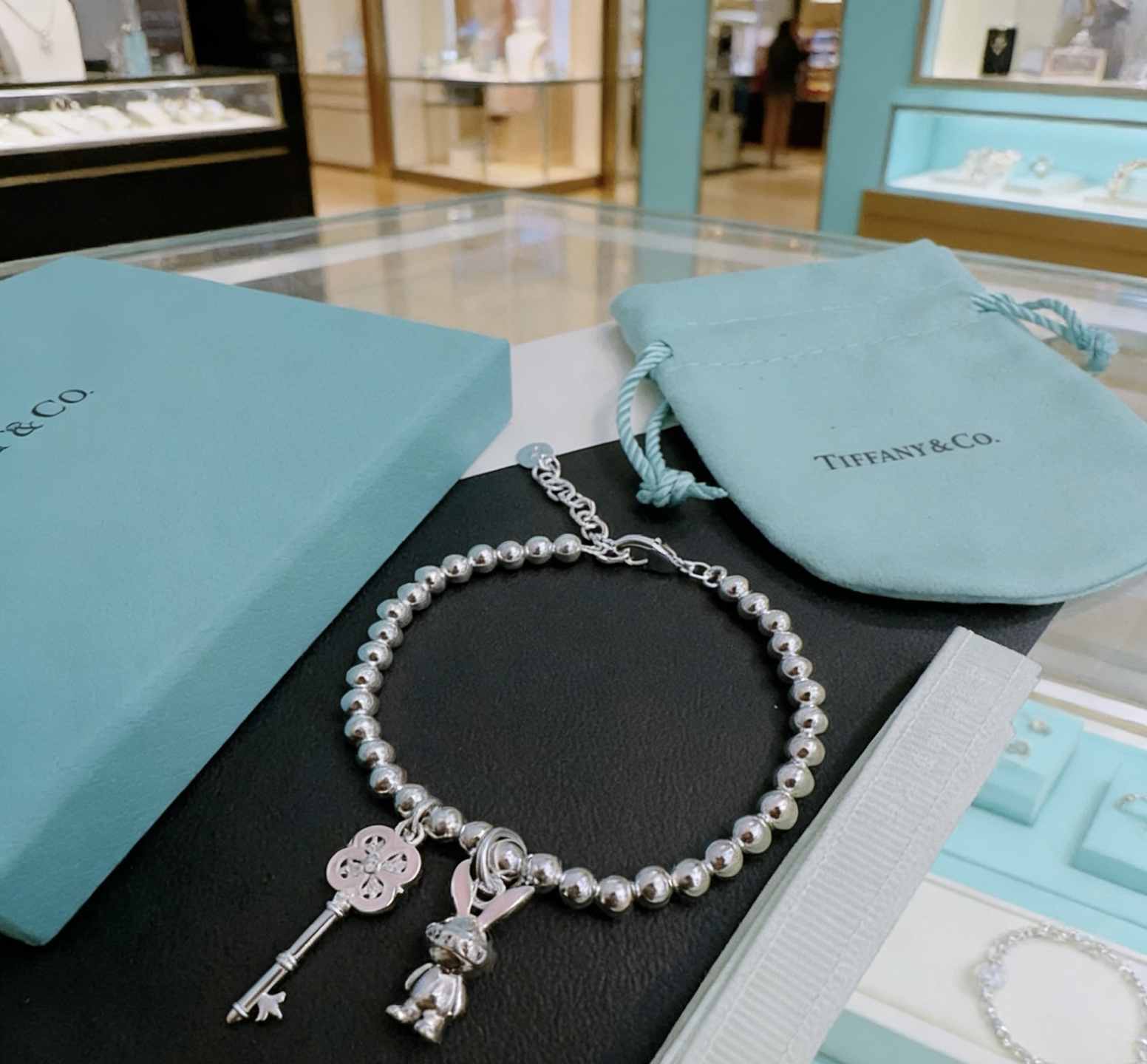Tiffany Co Return to Tiffany Bead Charm Bracelet bracelet Silver metal with pink enamel and clear stone accents 17cm