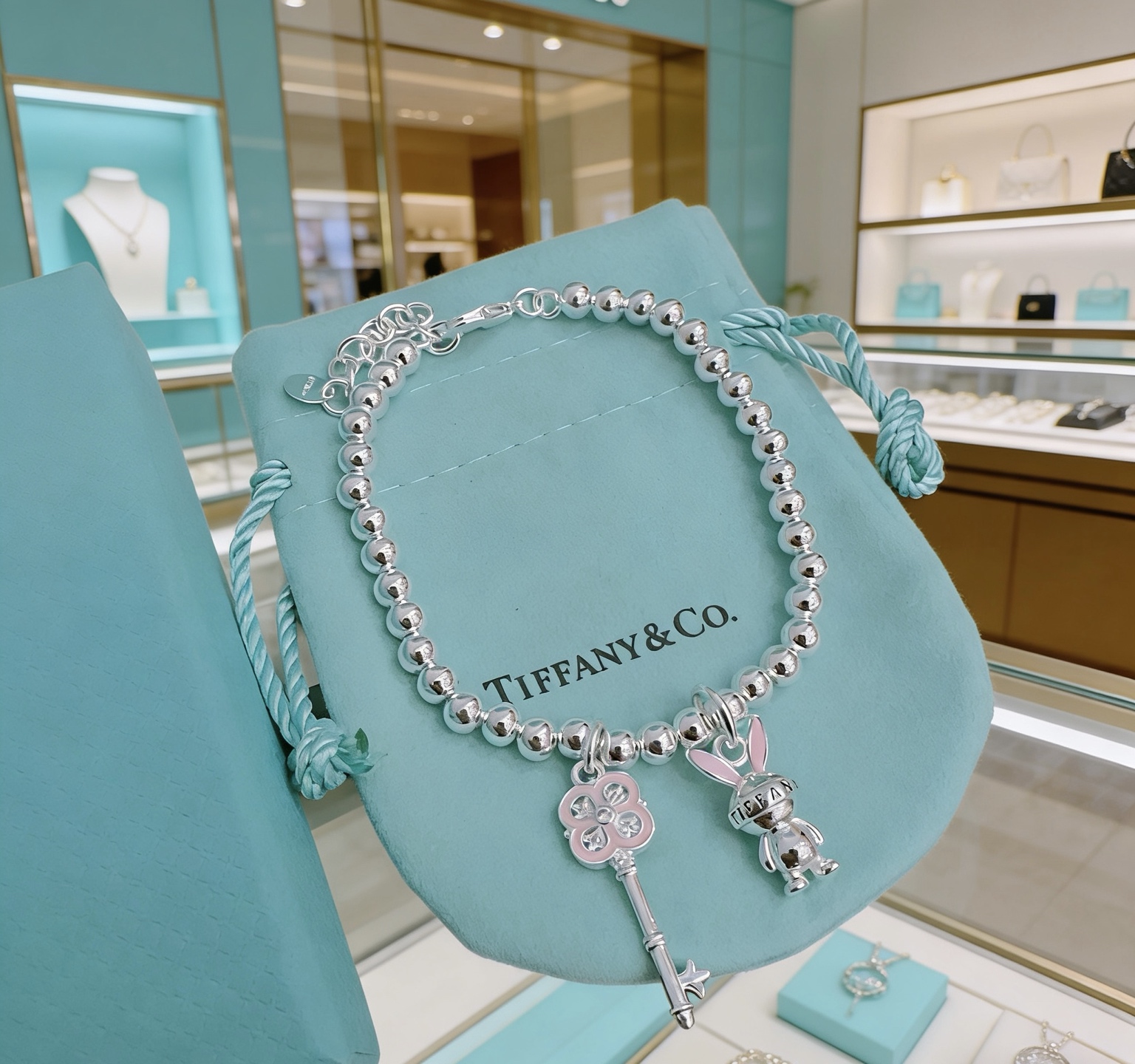 Tiffany Co Return to Tiffany Bead Charm Bracelet bracelet Silver metal with pink enamel and clear stone accents 17cm