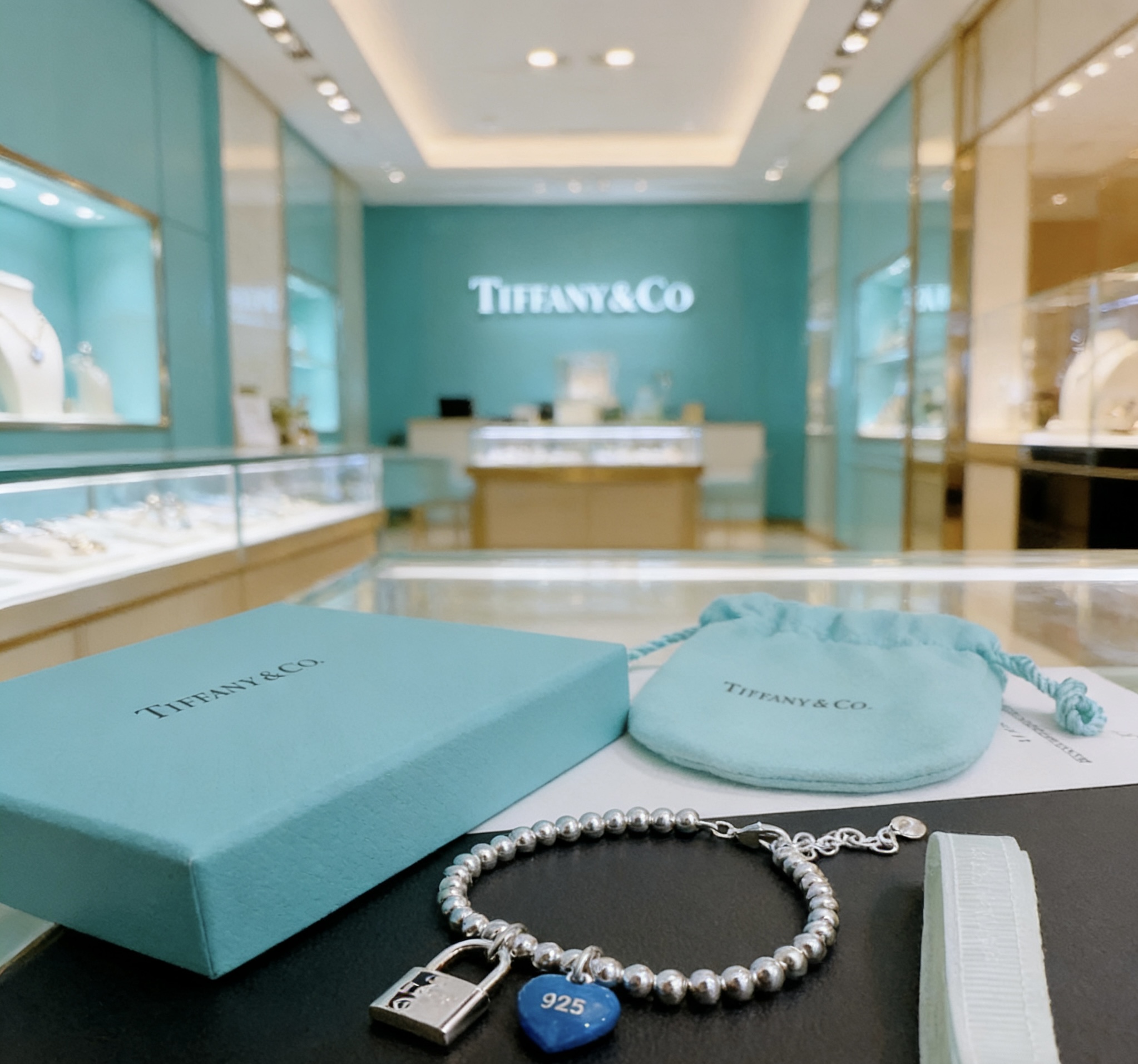 Tiffany Co Return to Tiffany Bead Bracelet with Blue Heart Tag and Lock Charm bracelet Sterling silver with blue enamel heart charm 18cm