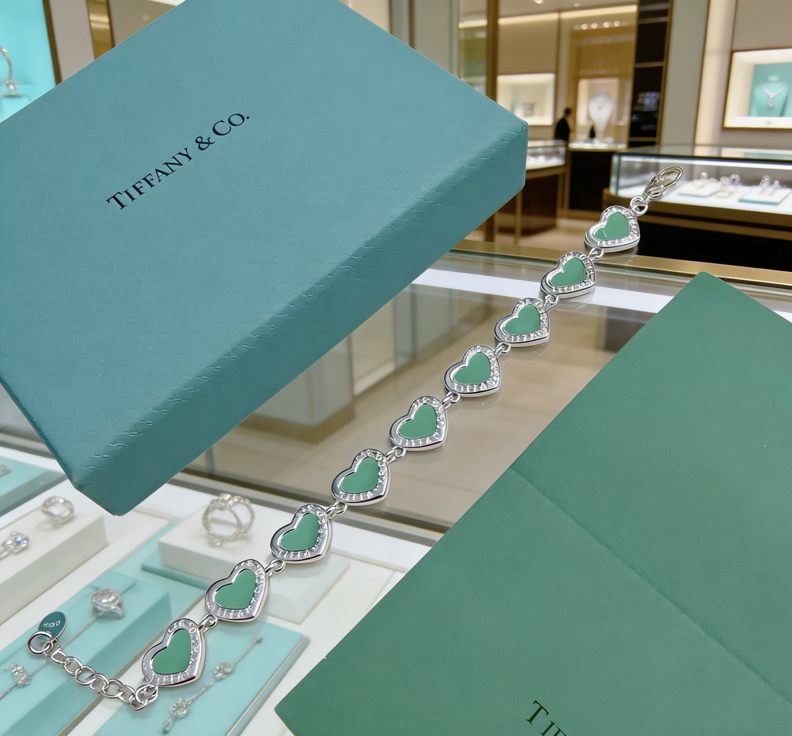 Tiffany Co Heart Link bracelet silver-toned metal with tiffany blue enamel and clear diamond accents 18cm
