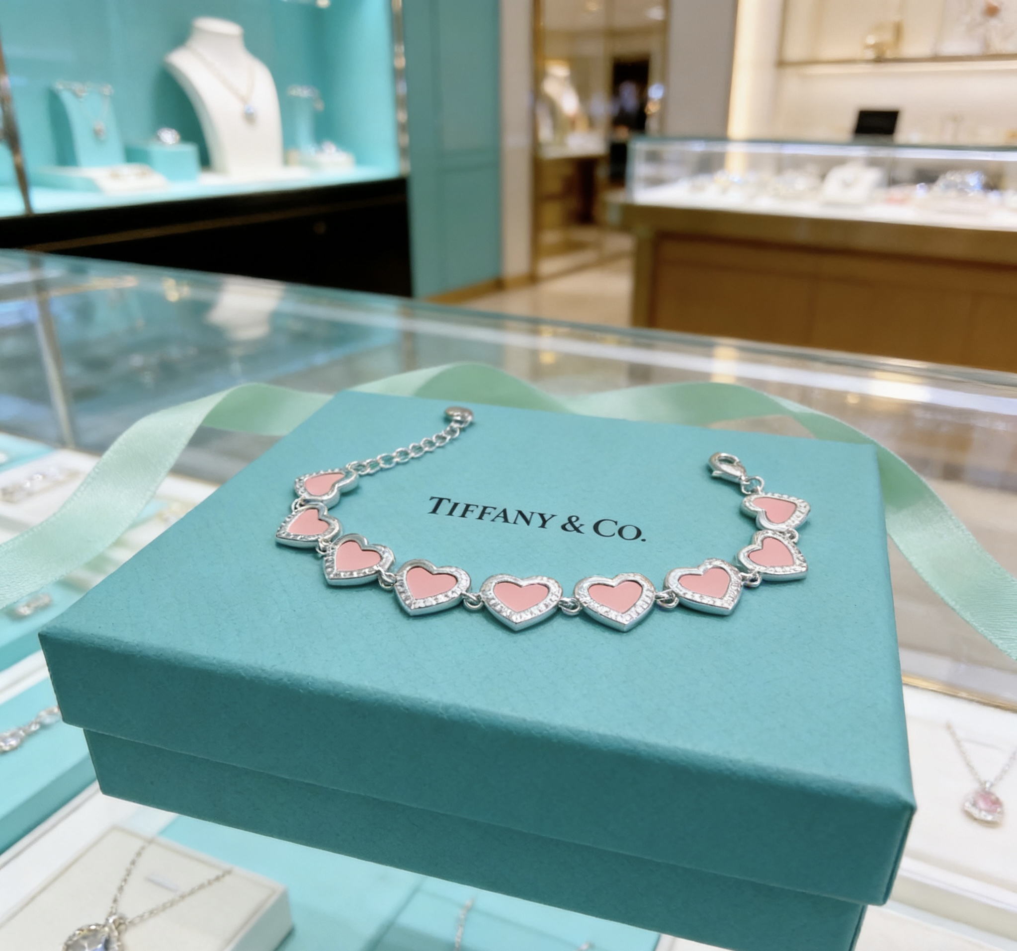 Tiffany Co Heart Link bracelet silver-toned metal with pink enamel and clear diamond-like accent stones 18cm adjustable