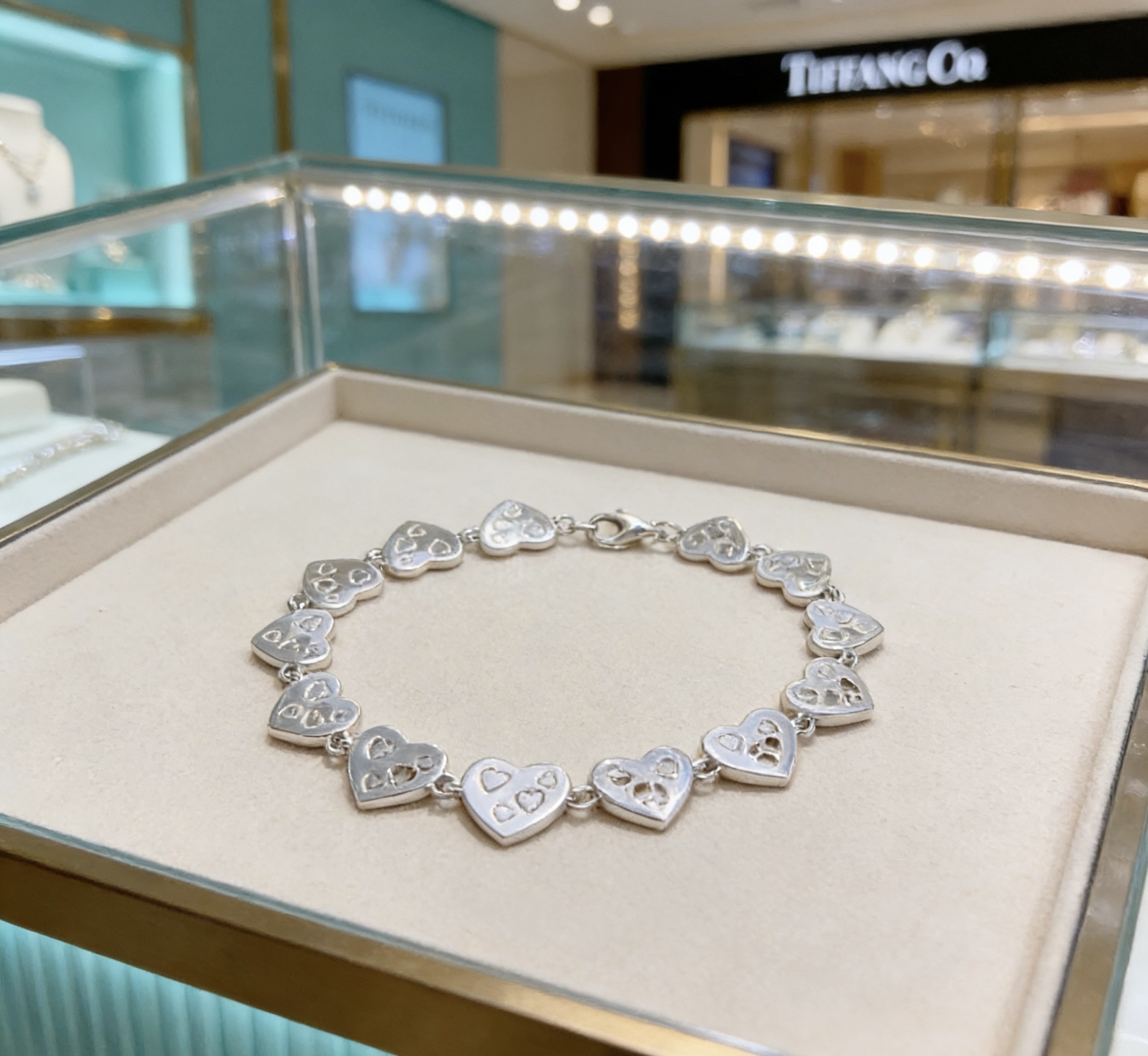 Tiffany Co Heart Link bracelet silver-toned metal with pink enamel and clear diamond-like accent stones 18cm adjustable