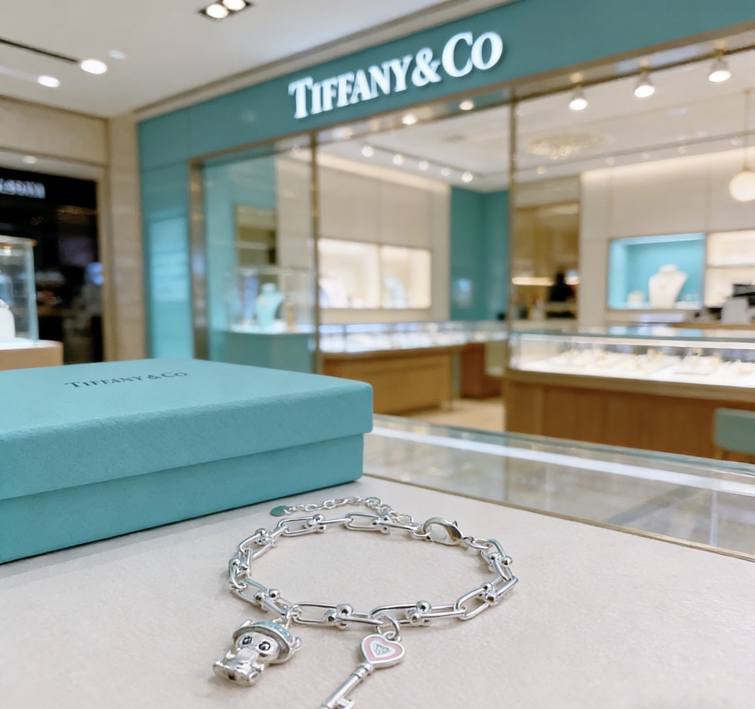Tiffany Co HardWear Charm bracelet silver metal with light blue and pink enamel accents 18cm