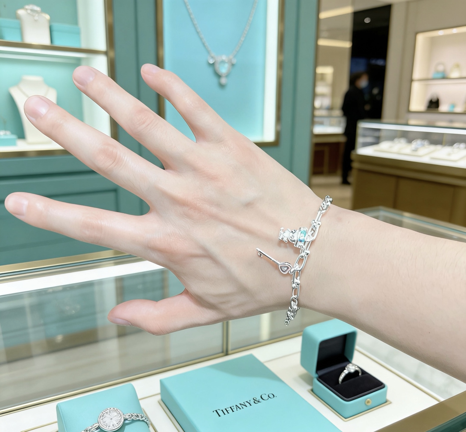 Tiffany Co HardWear Charm bracelet silver metal with light blue and pink enamel accents 18cm