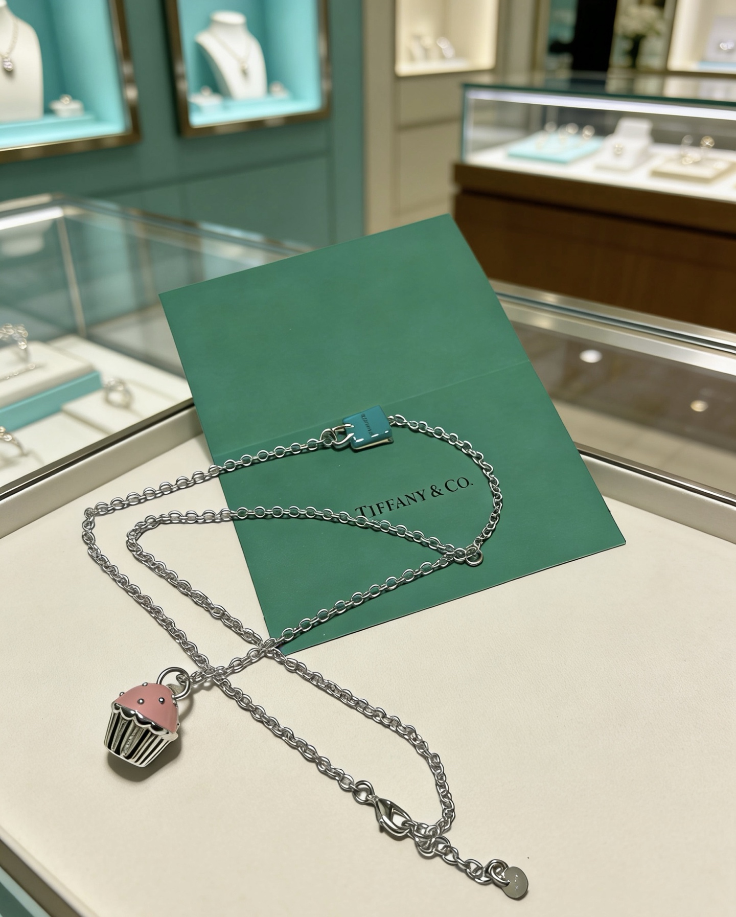 Tiffany Co Cupcake Charm Necklace necklace Sterling silver metal with pink enamel cupcake pendant accented by a signature Tiffany blue enamel charm 18 inches