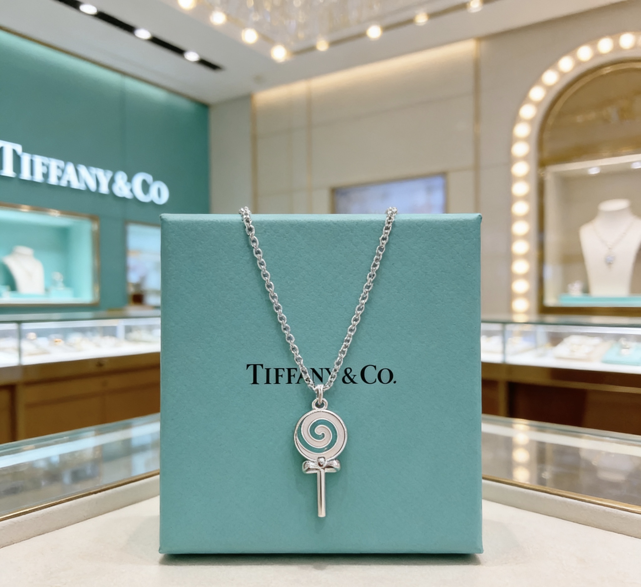 Tiffany Co Lollipop Charm necklace silver-toned metal with Tiffany blue and white enamel accented with clear pave stones on the attached heart tag 18 inches