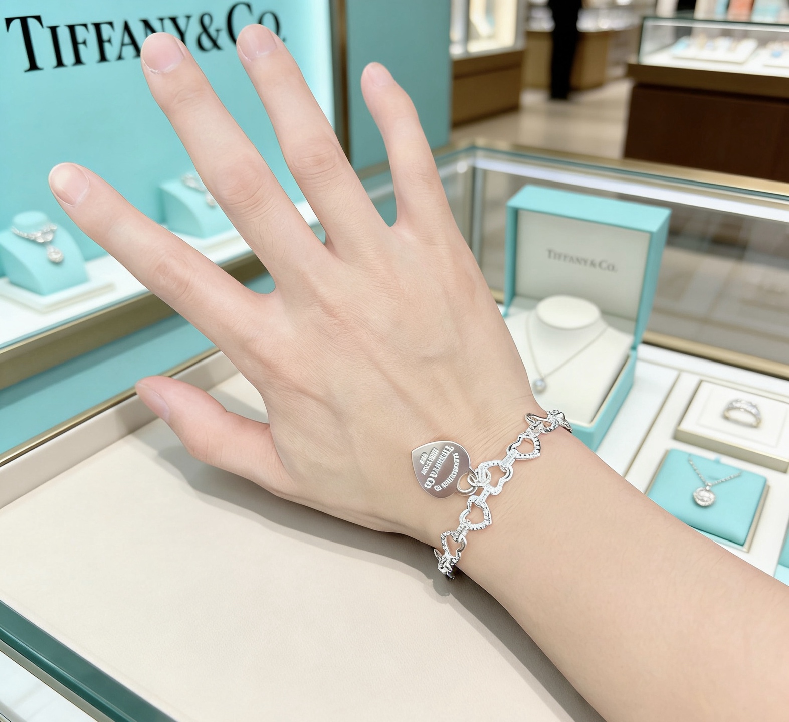 Tiffany Co Heart Link Toggle Bracelet with Pink Enamel Heart Tag bracelet silver-toned metal with clear pave accents and pink enamel heart charm 7 inches