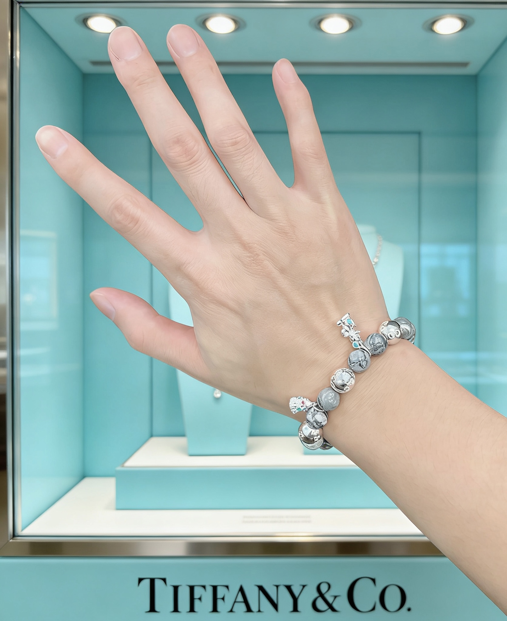 Tiffany Co Charm Bead Bracelet bracelet Sterling silver with grey patterned stone beads silver charms with red and green enamel accents 18cm
