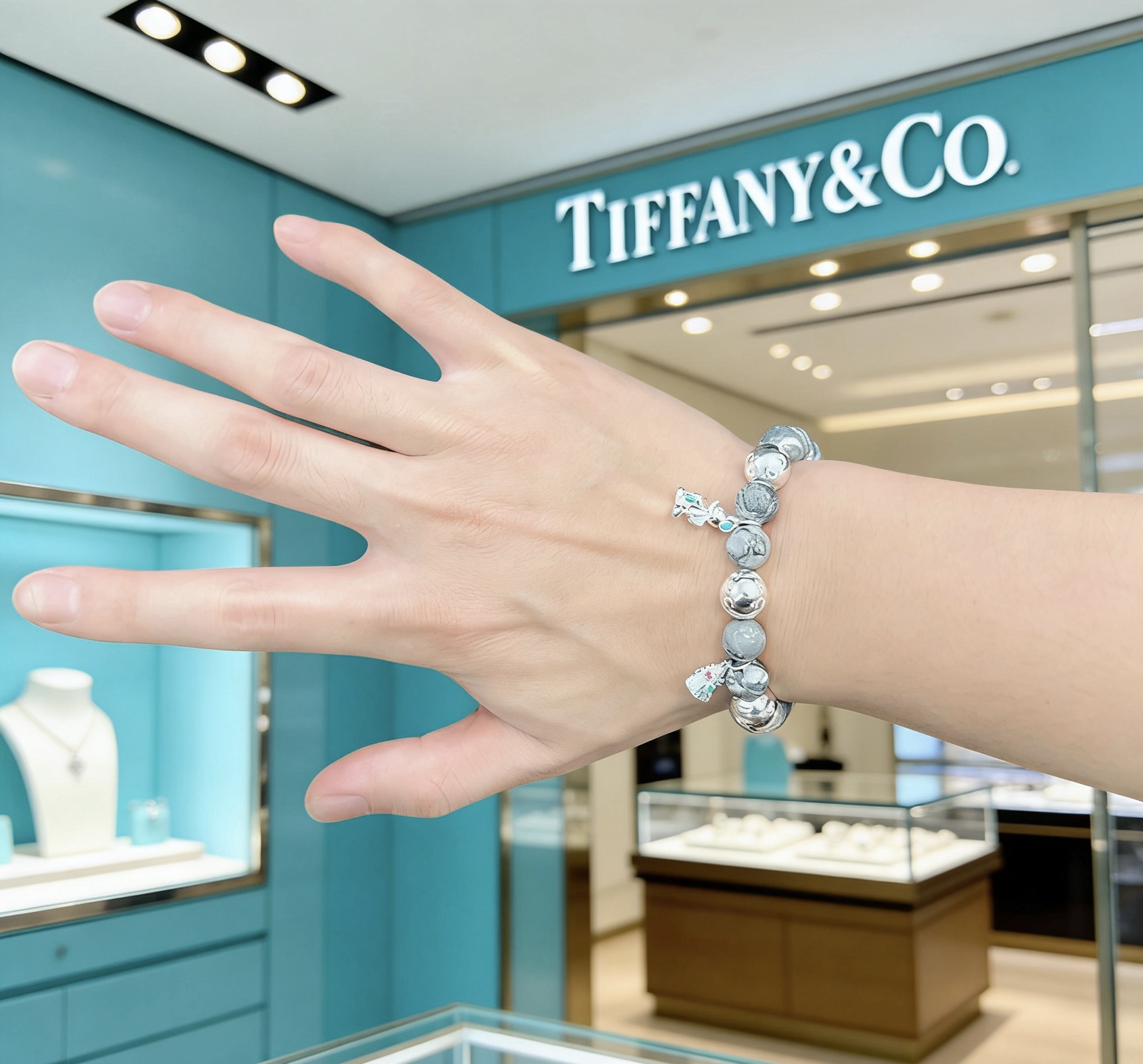 Tiffany Co Charm Bead Bracelet bracelet Sterling silver with grey patterned stone beads silver charms with red and green enamel accents 18cm
