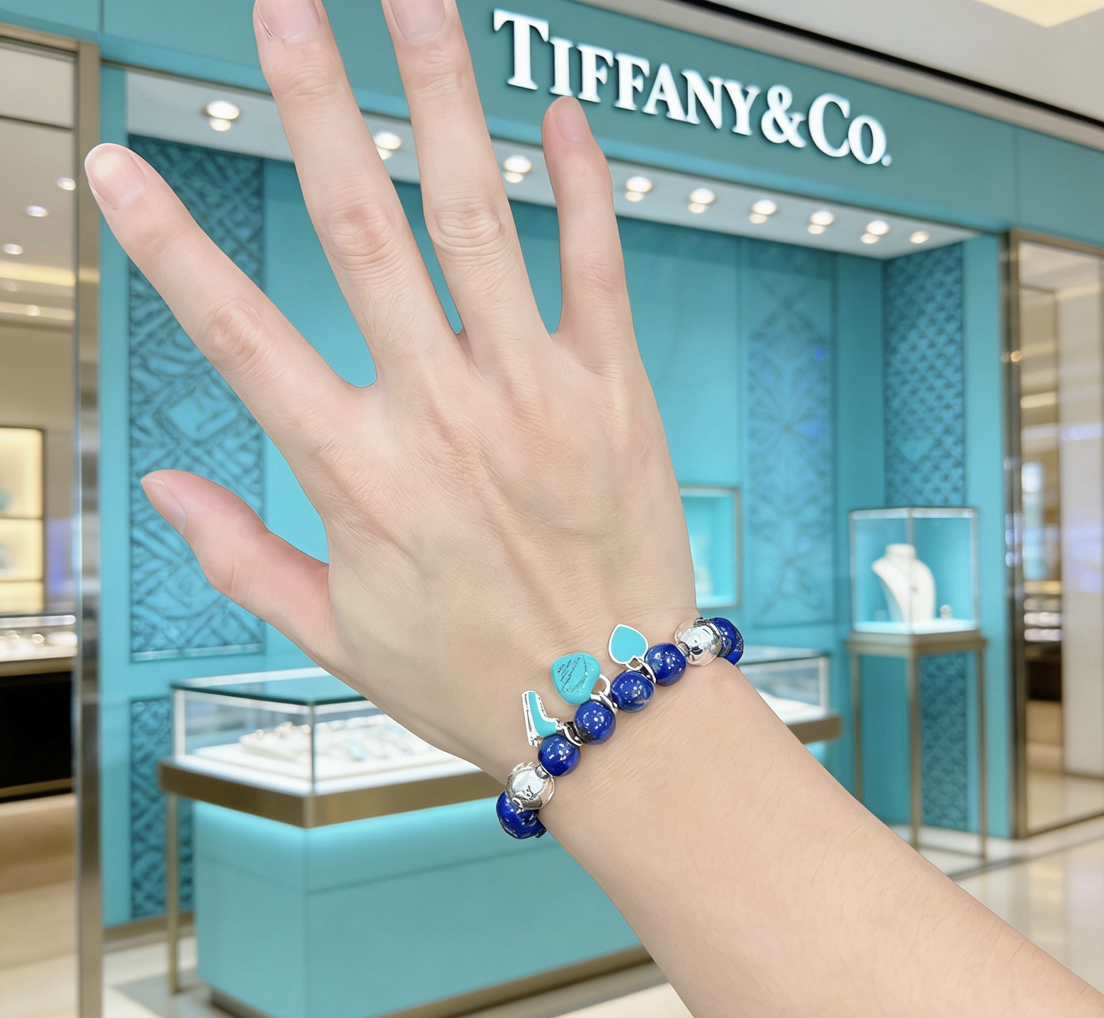 Tiffany Co Return to Tiffany Charm Bead Bracelet bracelet Sterling silver with deep blue lapis lazuli beads and signature Tiffany Blue enamel charms 18cm
