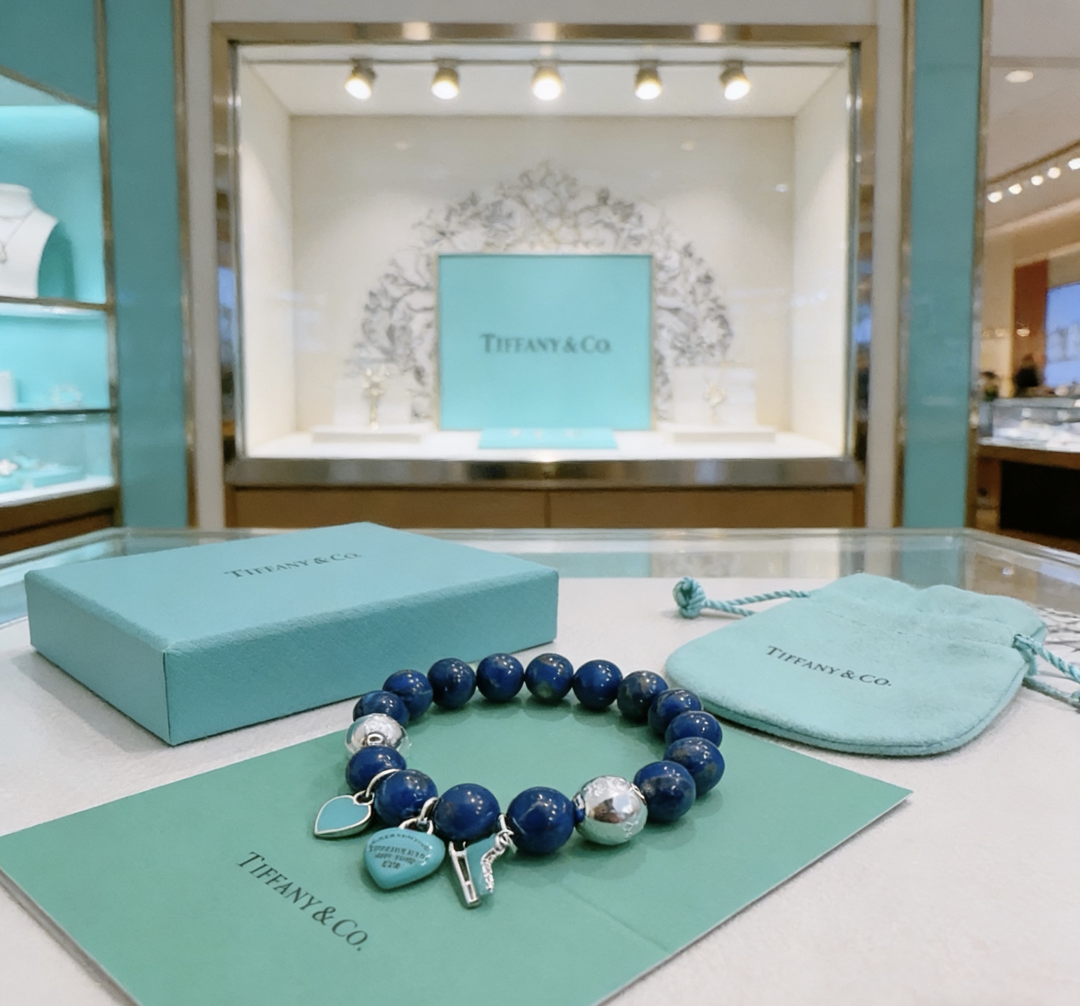 Tiffany Co Return to Tiffany Charm Bead Bracelet bracelet Sterling silver with deep blue lapis lazuli beads and signature Tiffany Blue enamel charms 18cm