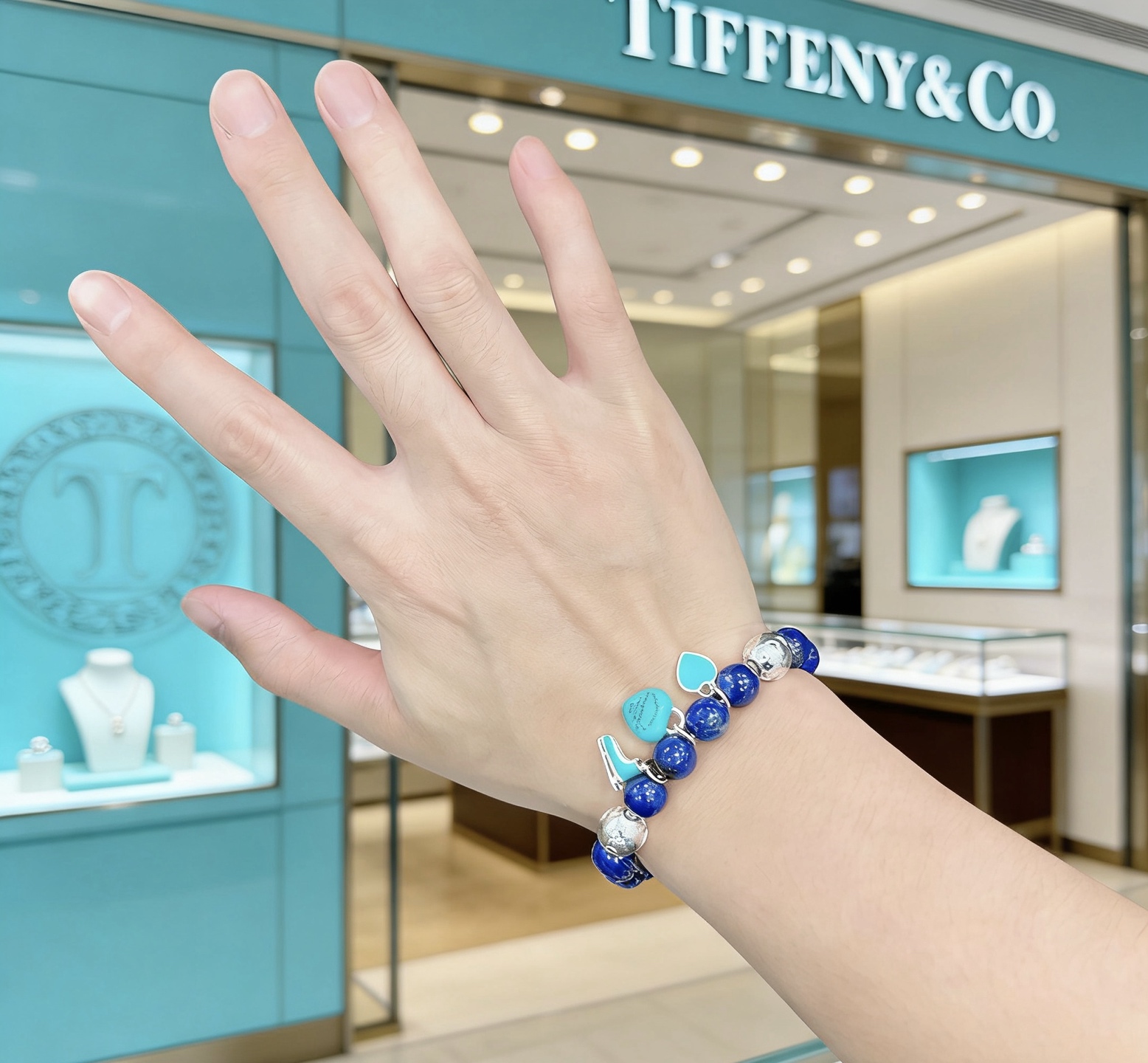 Tiffany Co Return to Tiffany Charm Bead Bracelet bracelet Sterling silver with deep blue lapis lazuli beads and signature Tiffany Blue enamel charms 18cm