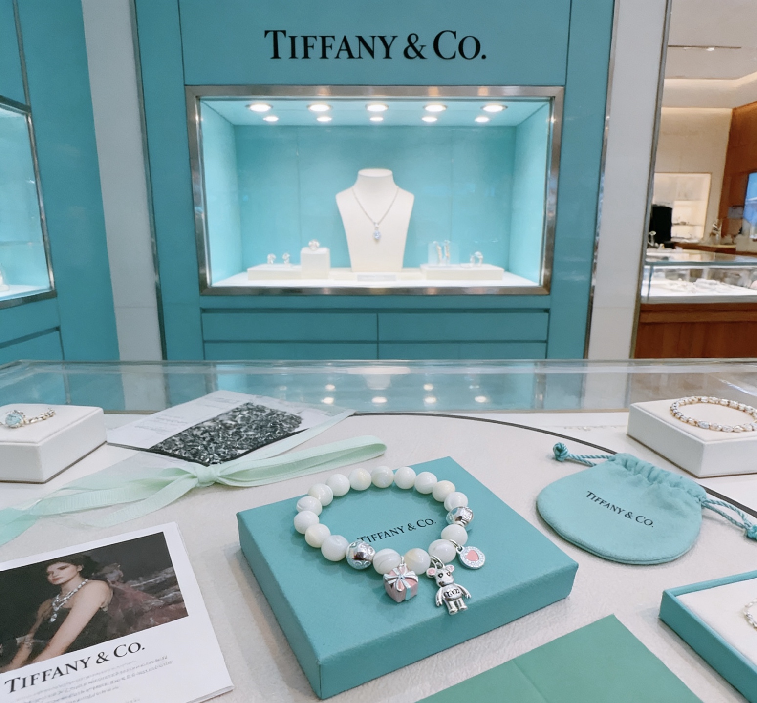 Tiffany Co Charm Bead Bracelet bracelet Silver-toned metal with white mother-of-pearl beads pink enamel accents on charms 17cm