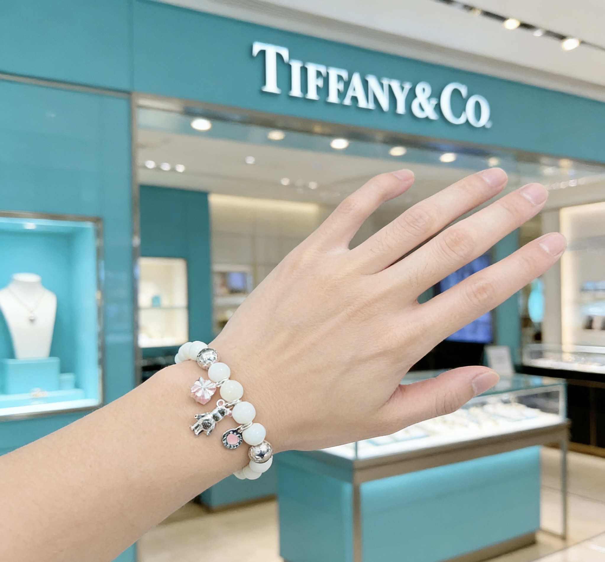 Tiffany Co Charm Bead Bracelet bracelet Silver-toned metal with white mother-of-pearl beads pink enamel accents on charms 17cm
