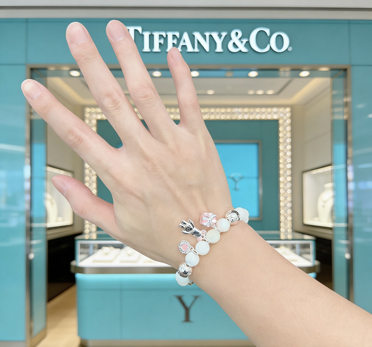 Tiffany Co Charm Bead Bracelet bracelet Silver-toned metal with white mother-of-pearl beads pink enamel accents on charms 17cm