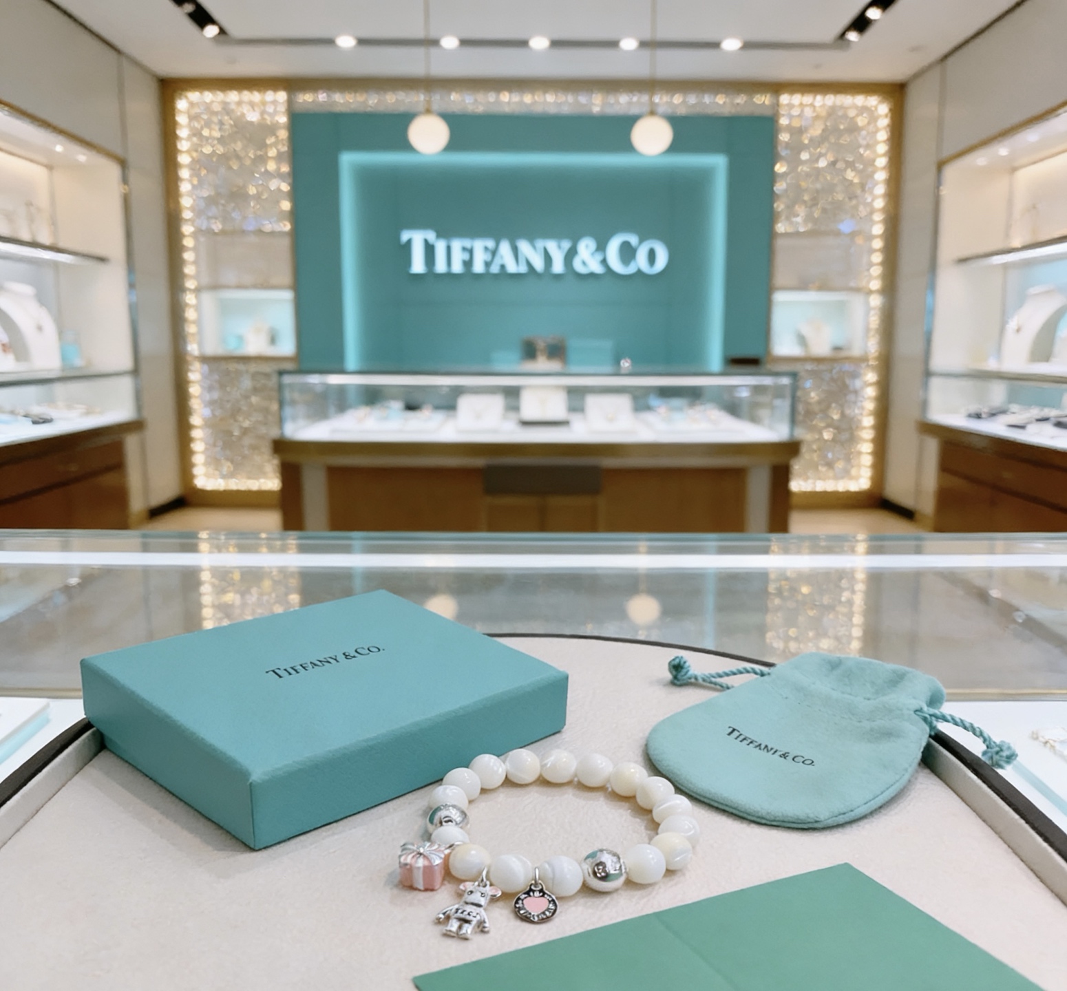 Tiffany Co Charm Bead Bracelet bracelet Silver-toned metal with white mother-of-pearl beads pink enamel accents on charms 17cm