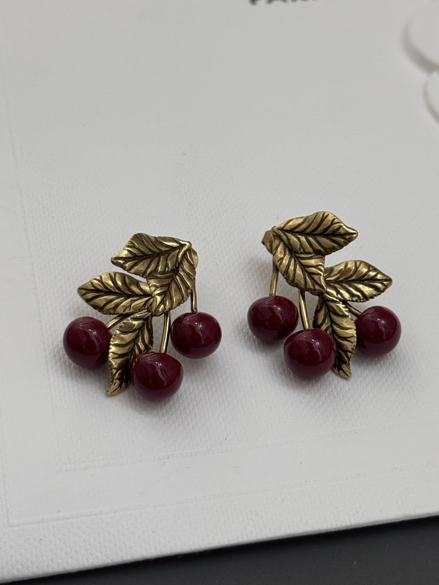 Saint Laurent Cherry Motif earrings antique gold metal deep burgundy red resin cherries 2 5cm length