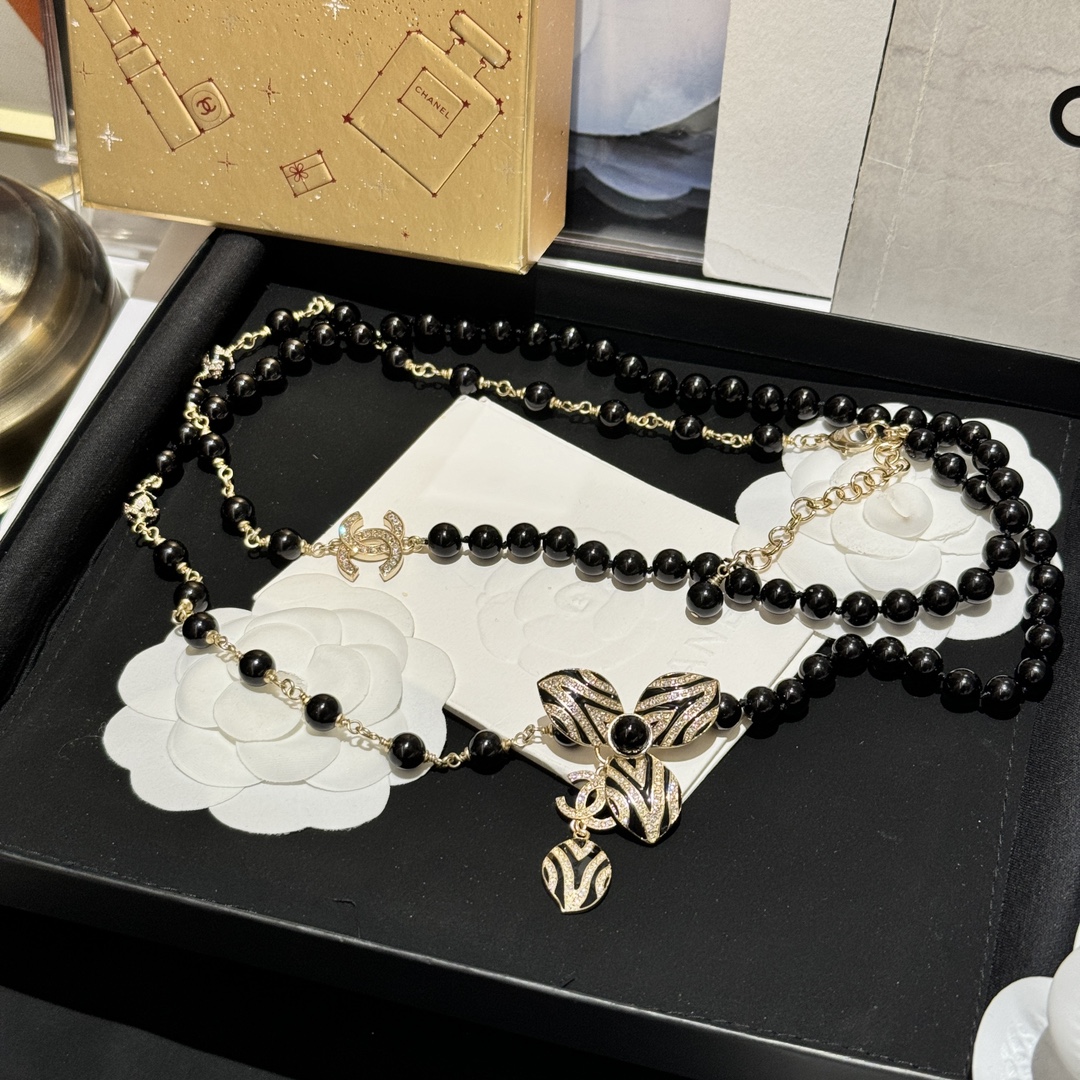 Chanel CC Zebra Stripe Flower Pendant Long Beaded Necklace necklace Gold-tone metal black resin beads black enamel clear crystal accents 80cm