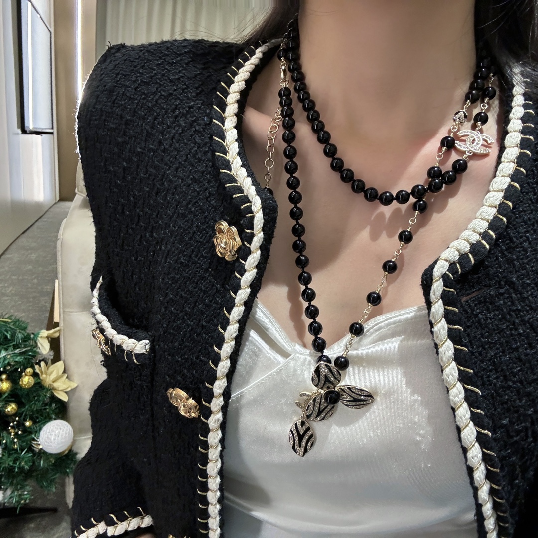 Chanel CC Zebra Stripe Flower Pendant Long Beaded Necklace necklace Gold-tone metal black resin beads black enamel clear crystal accents 80cm