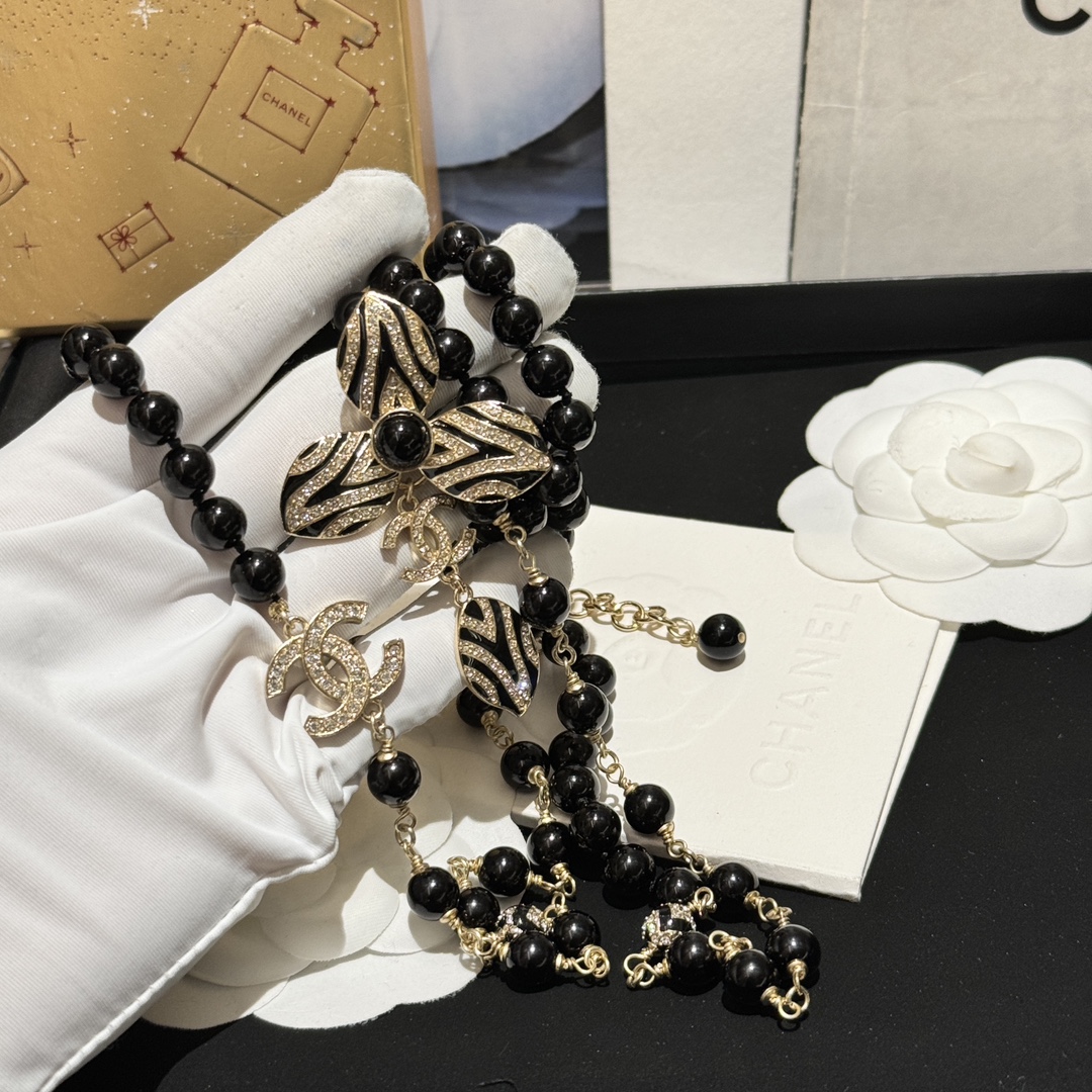 Chanel CC Zebra Stripe Flower Pendant Long Beaded Necklace necklace Gold-tone metal black resin beads black enamel clear crystal accents 80cm