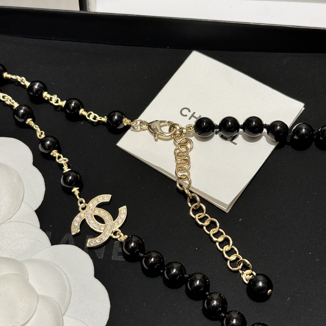 Chanel CC Zebra Stripe Flower Pendant Long Beaded Necklace necklace Gold-tone metal black resin beads black enamel clear crystal accents 80cm
