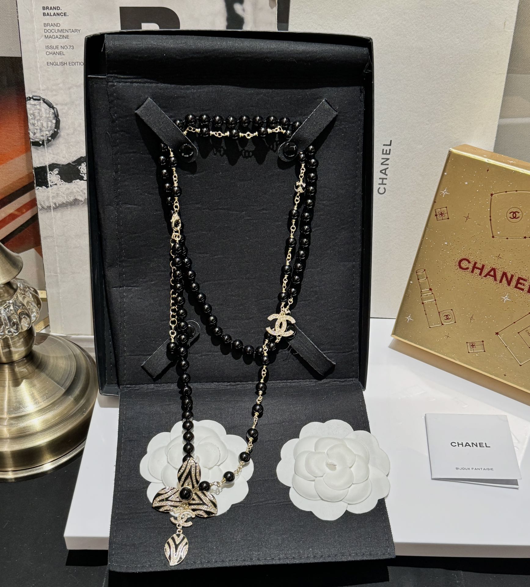 Chanel CC Zebra Stripe Flower Pendant Long Beaded Necklace necklace Gold-tone metal black resin beads black enamel clear crystal accents 80cm