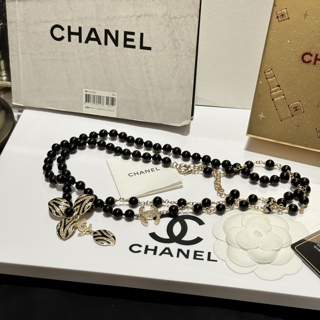 Chanel CC Zebra Stripe Flower Pendant Long Beaded Necklace necklace Gold-tone metal black resin beads black enamel clear crystal accents 80cm