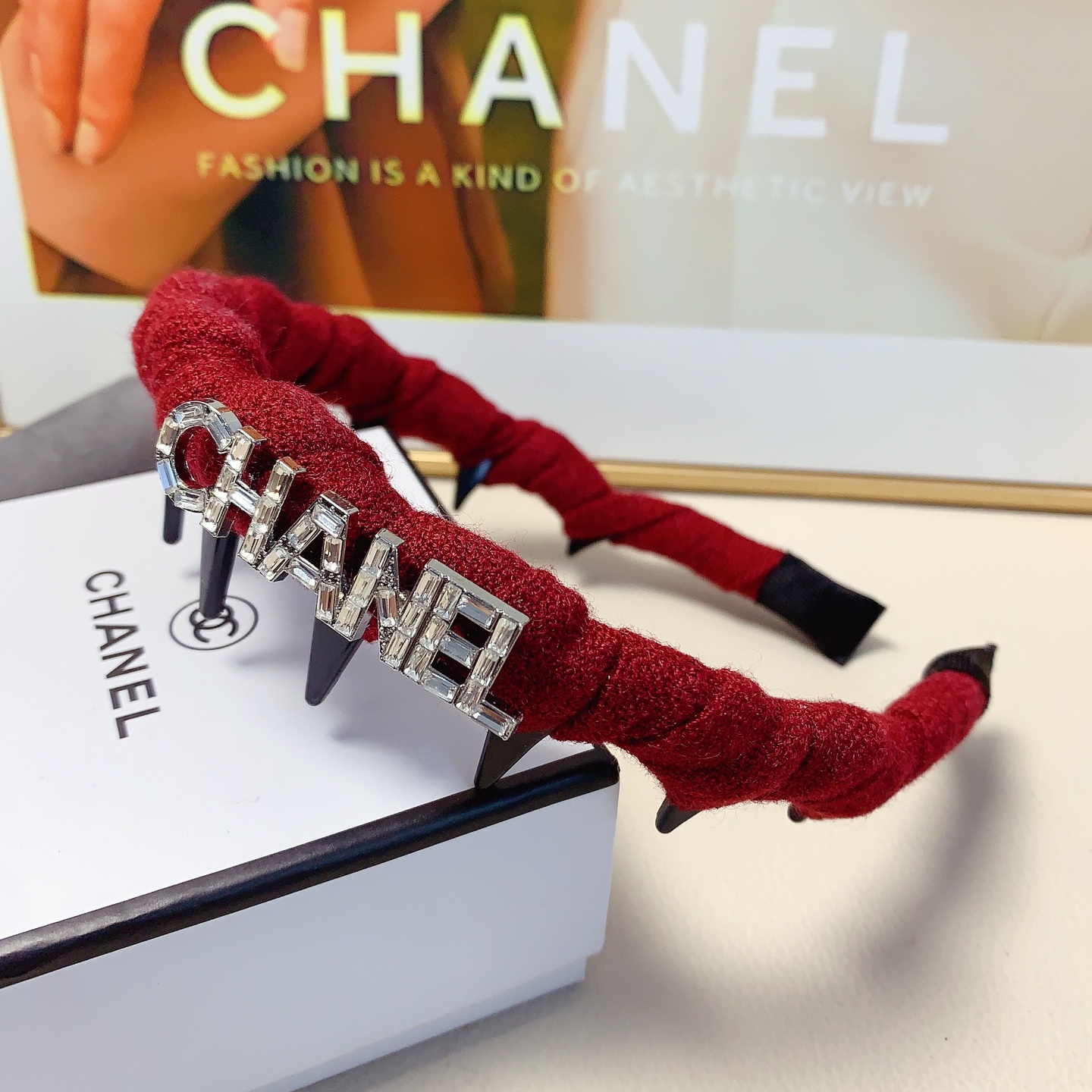 Chanel Crystal Logo Spiked Headband brooch Red fabric with black spikes and silver-tone crystal logo Black and white tweed fabric with black spikes and gold-tone CD logo One Size