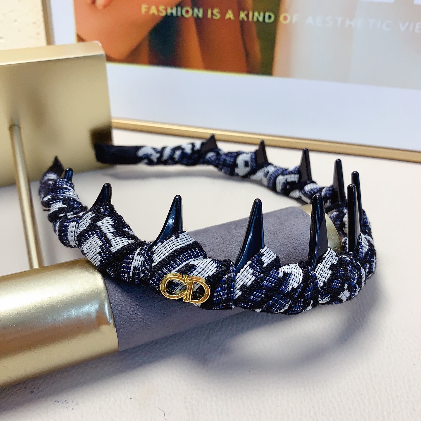 Chanel Crystal Logo Spiked Headband brooch Red fabric with black spikes and silver-tone crystal logo Black and white tweed fabric with black spikes and gold-tone CD logo One Size