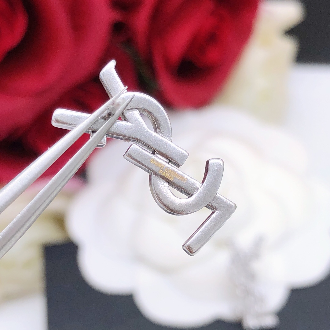 Saint Laurent YSL Monogram earrings silver-toned metal with clear crystal accents 1 5cm stud length